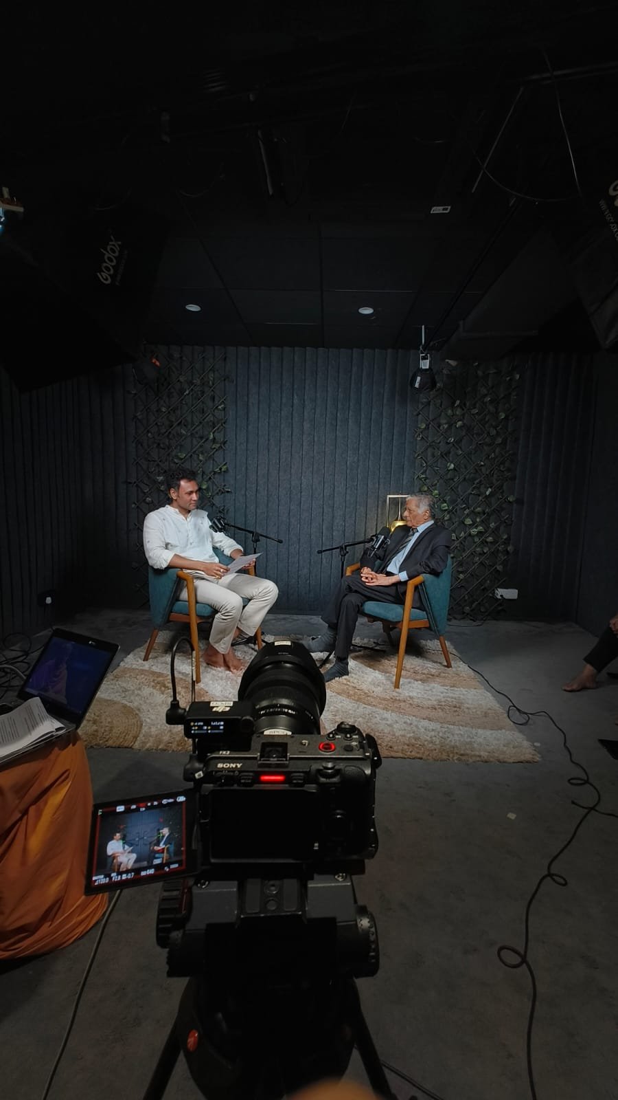 Untold Lens filming an interview podcast